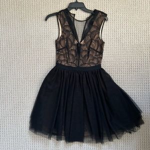 Bebe, size XS, worn once. Like new condition. Nude with black lace